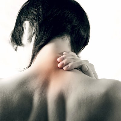 person holds neck that is highlighted to illustrate pain
