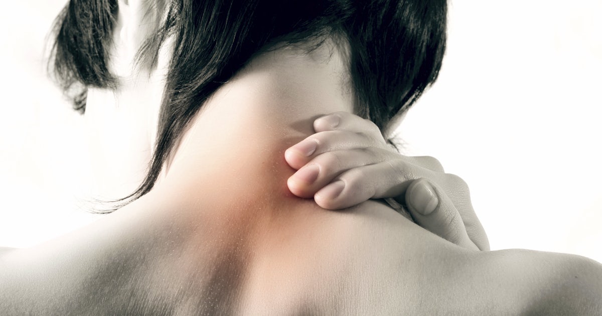 person holds neck that is highlighted to illustrate pain