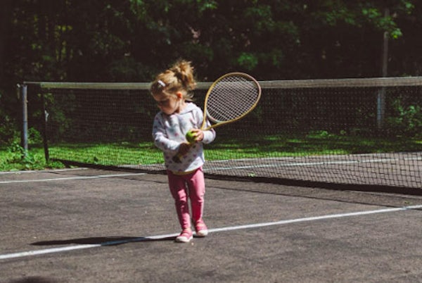 baby playing tennis