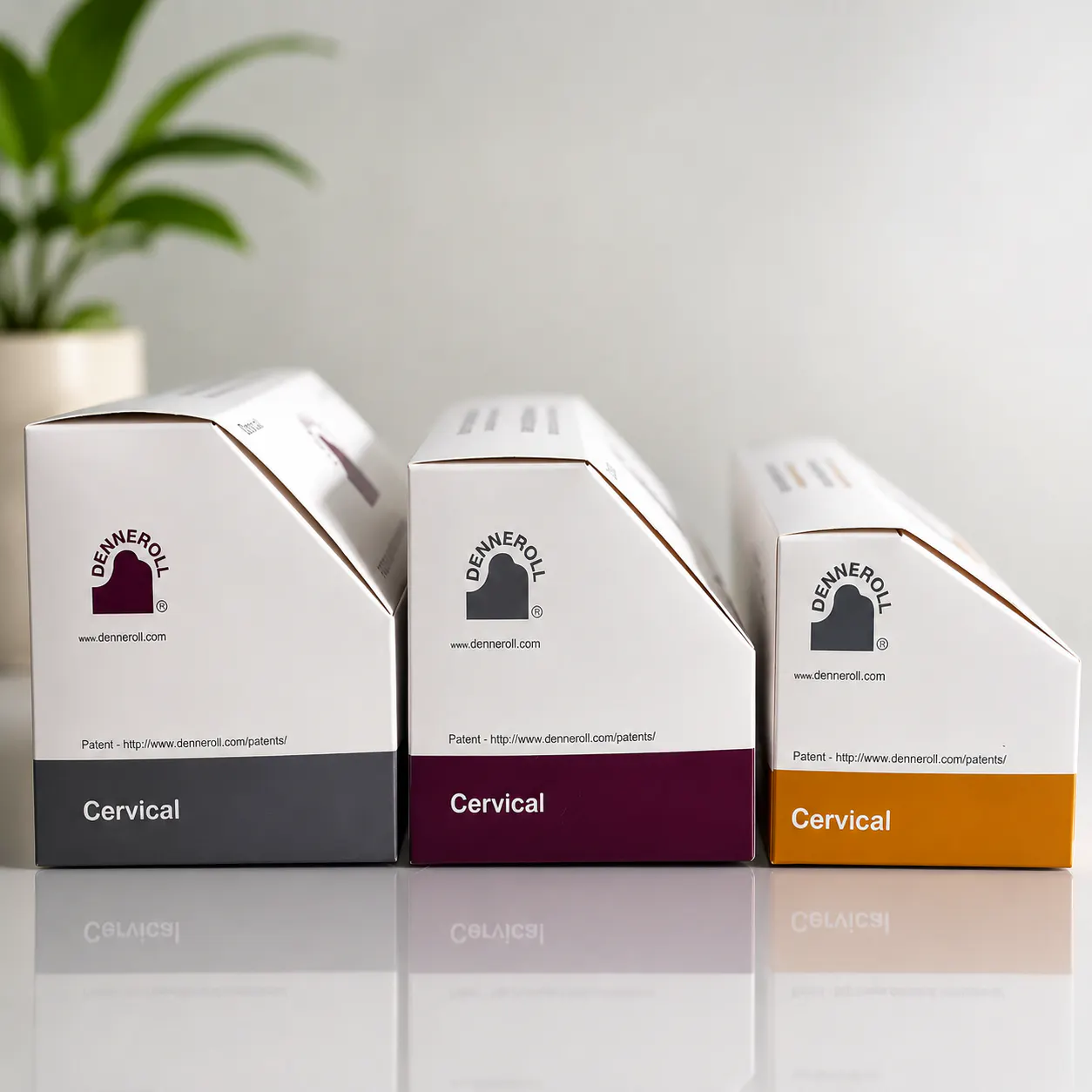 Denneroll Cervical Orthotic Device boxes in large, medium, and small sizes
