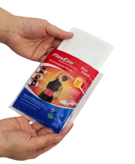 FlexEze Heat Patch being removed from pouch