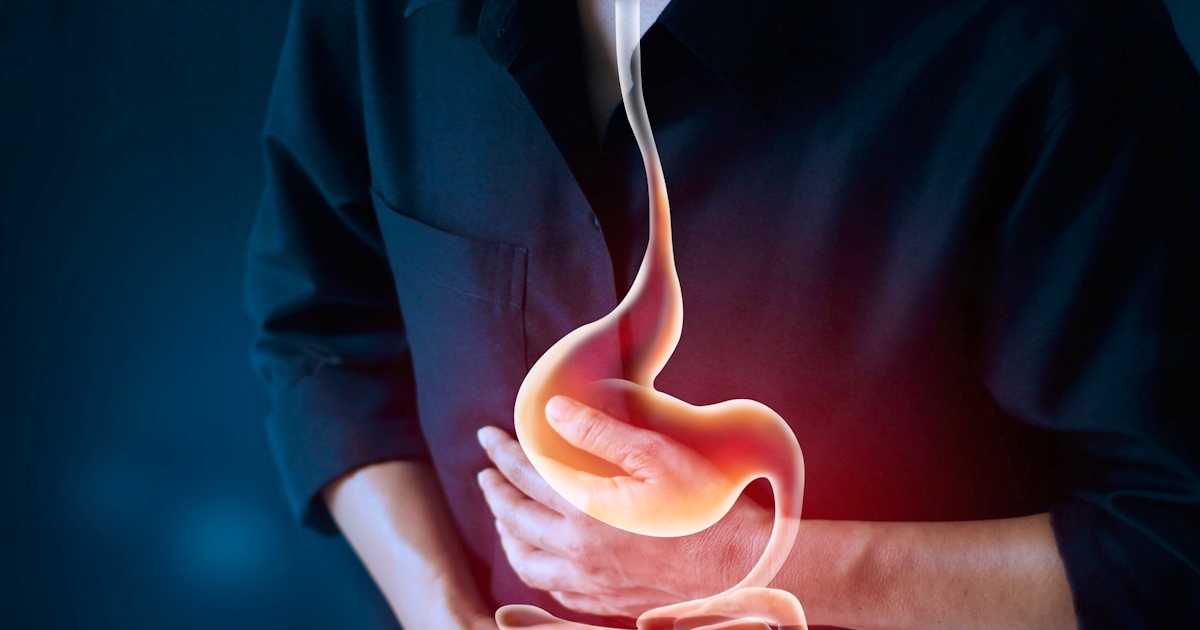 Working man touching stomach, suffering painful of