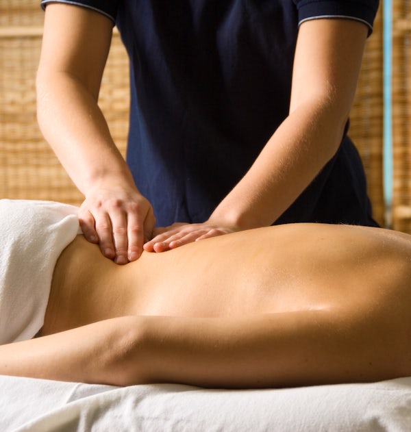 brunette female getting massage lower back