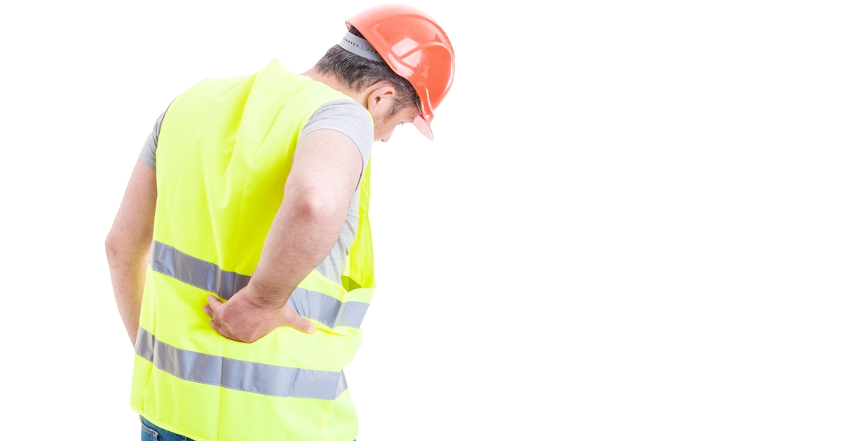 construction worker from behind right hand holding lower back