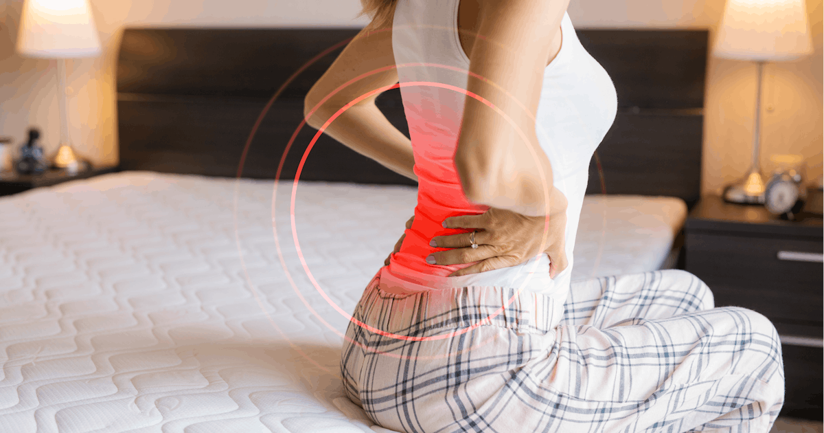 Woman suffering from back pain because of uncomfor