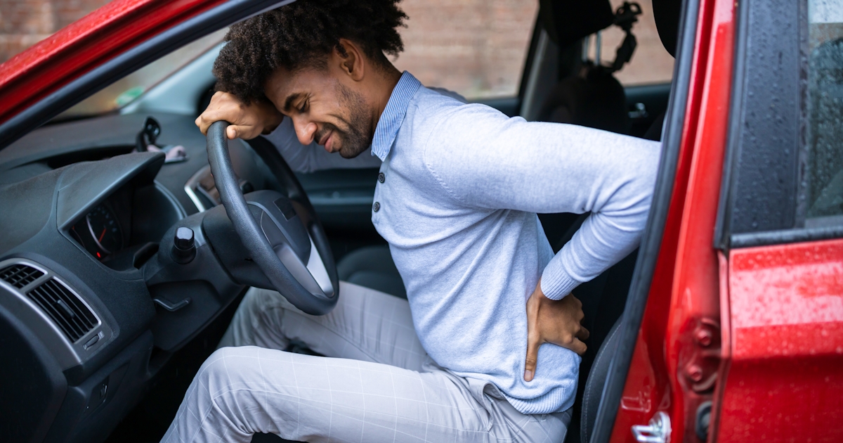 male driver suffering with back pain
