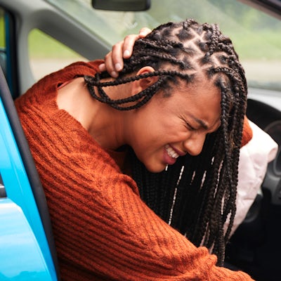 Female Motorist With Whiplash Injury In Car Crash