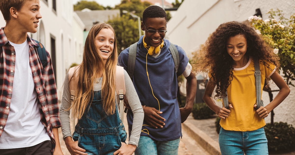 Friends walking together in an alley