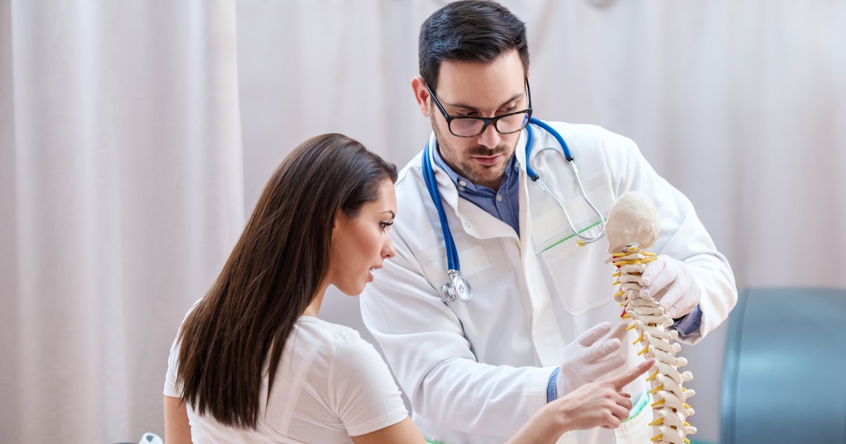 Female patient sitting with backs turned showing o