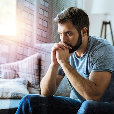 Thoughtful serious man sitting and thinking