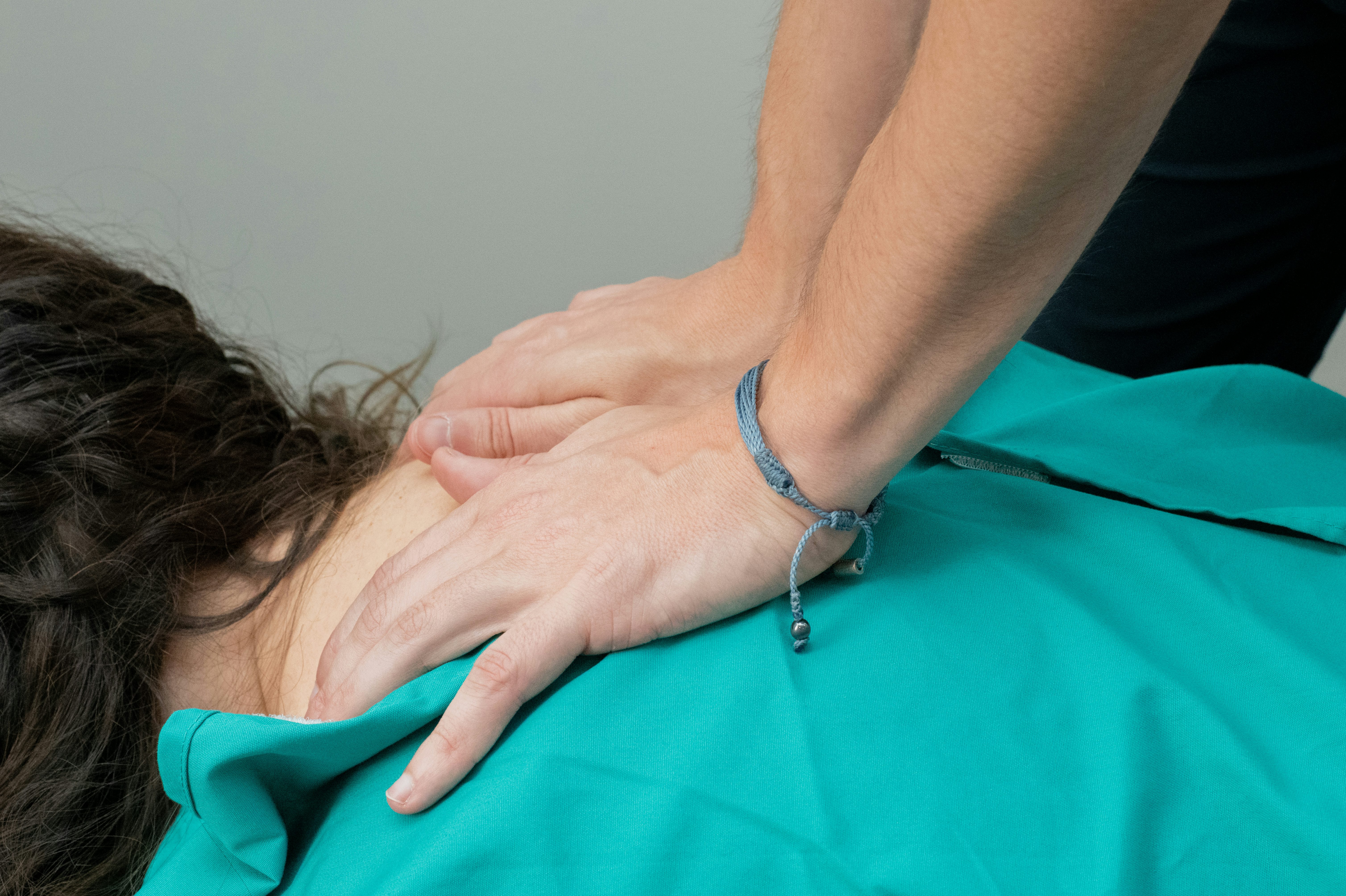 close up shot of a chiropractic doctor performing an adjustment on a patient