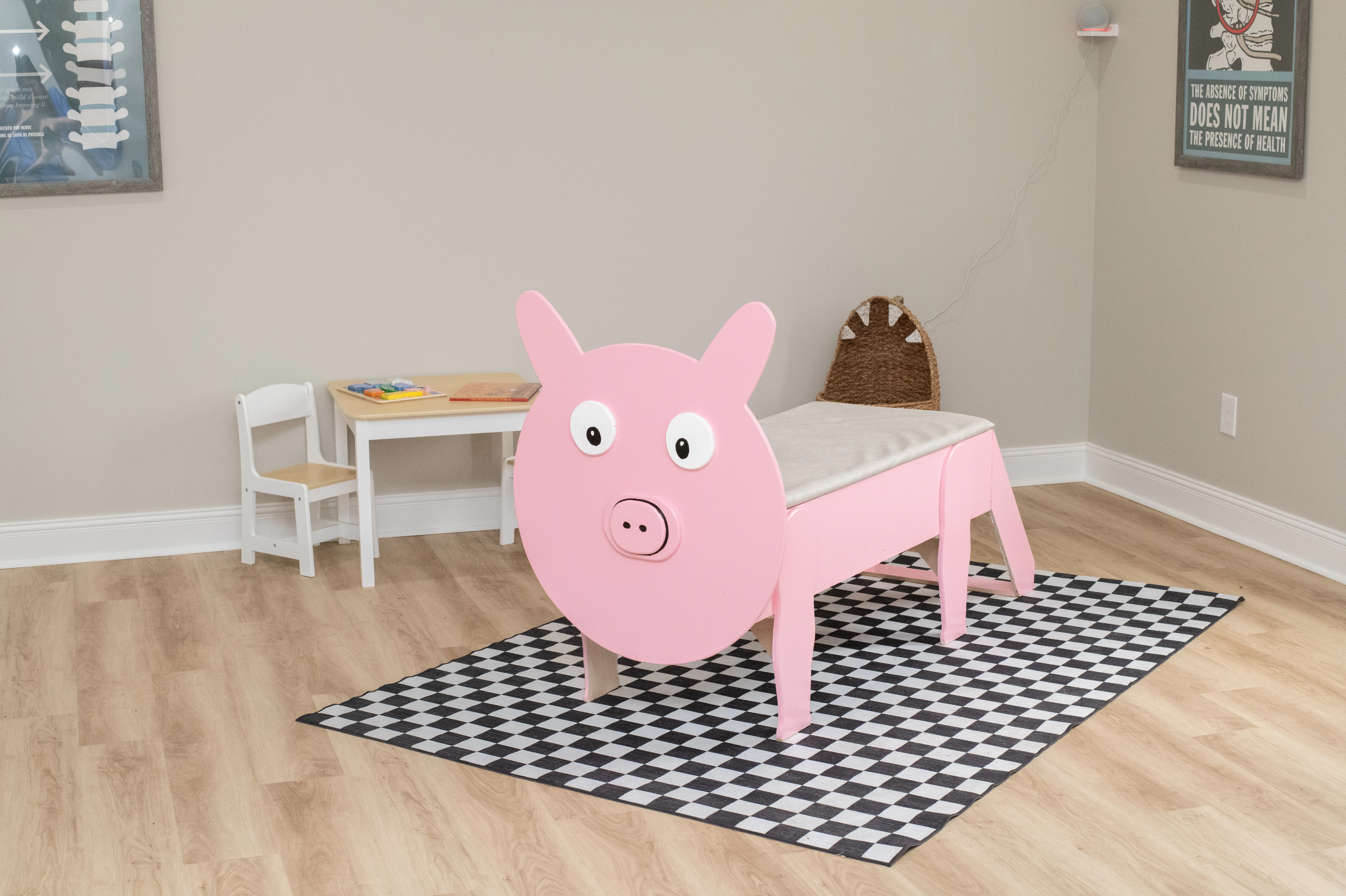 a small table that resembles a pig in a chiropractic treatment room.