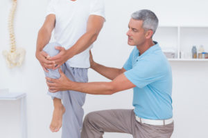 patient with chiropractor experiencing Complex Regional Pain Syndrome