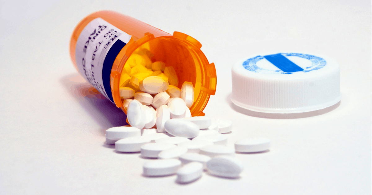 Medicine Bottle and White Pills