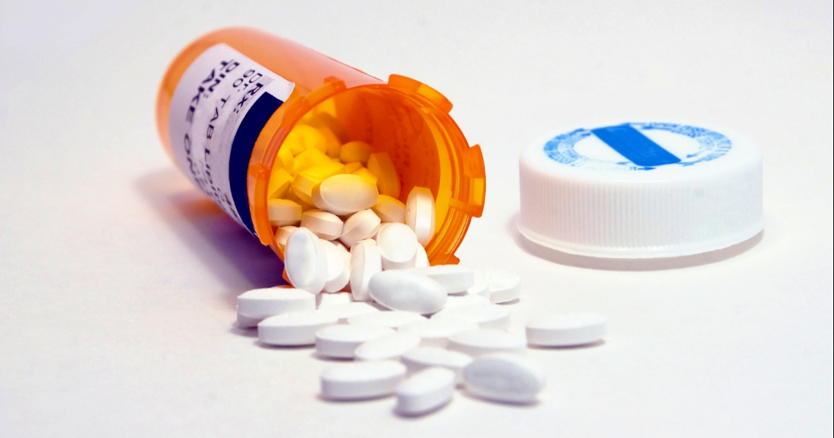 Medicine Bottle and White Pills