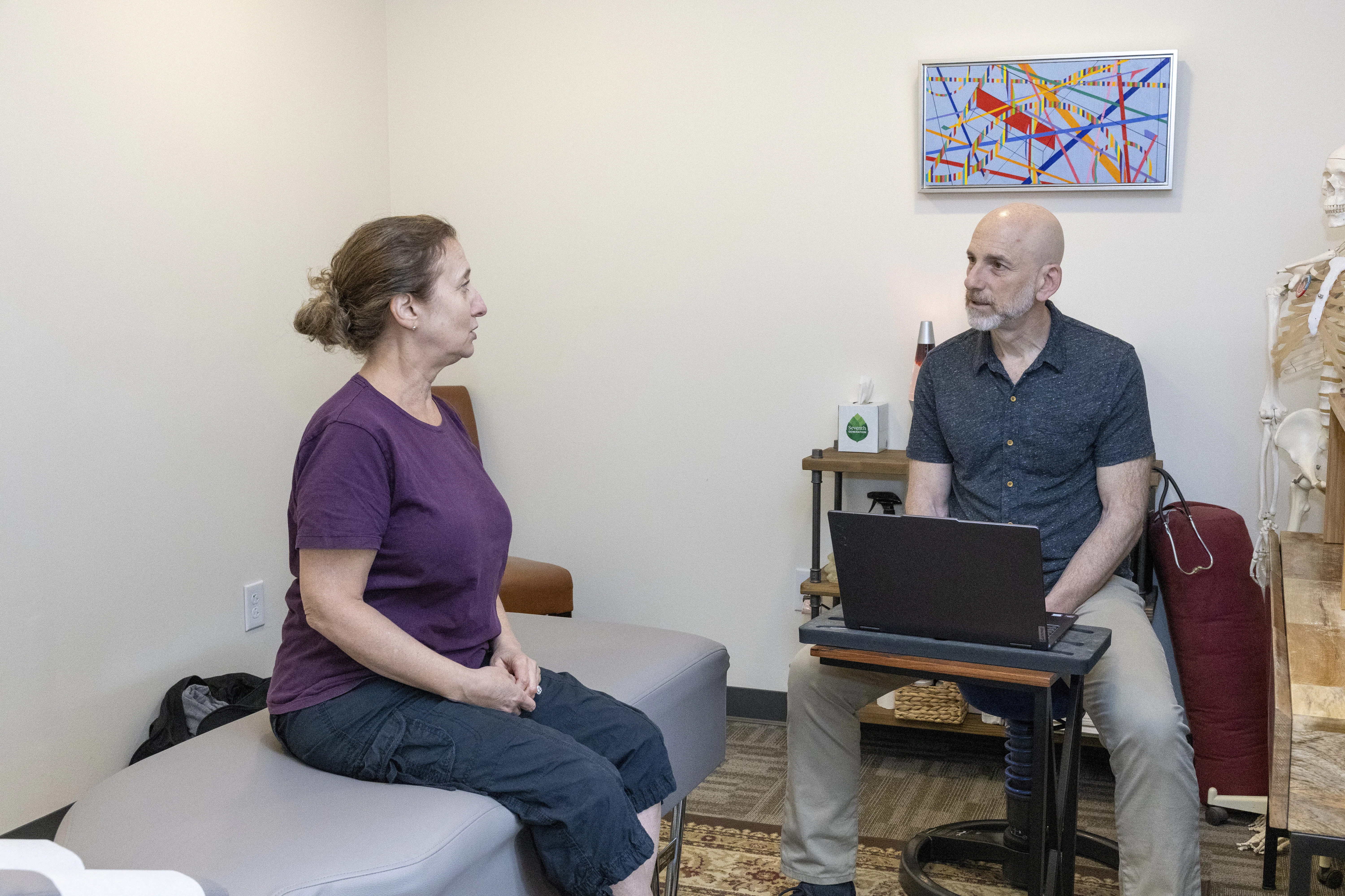 Dr. Charno consulting with a new patient on their first visit.