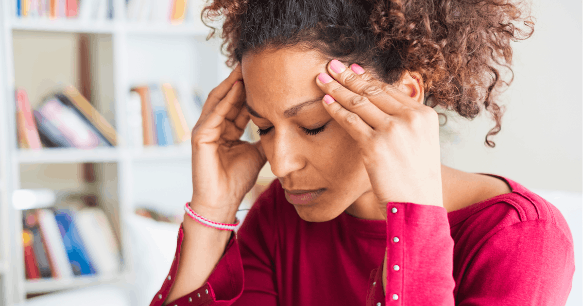 Young black woman suffering strong headache