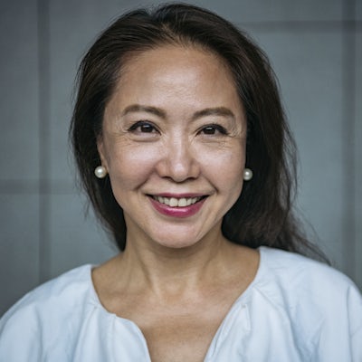 Attractive senior Chinese woman smiling