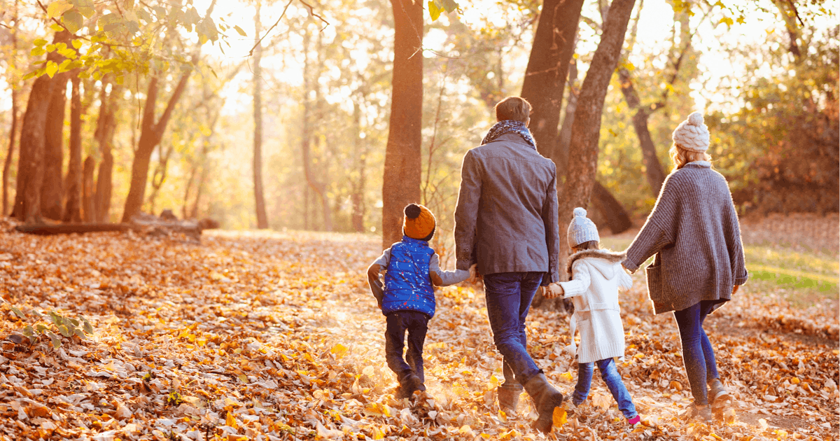 Family enjoying beautiful autumn day in the park