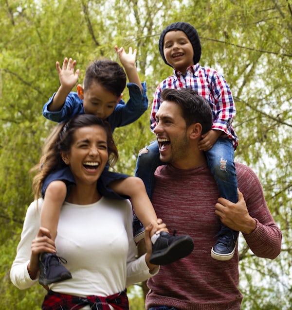 Family has fun playing in the field