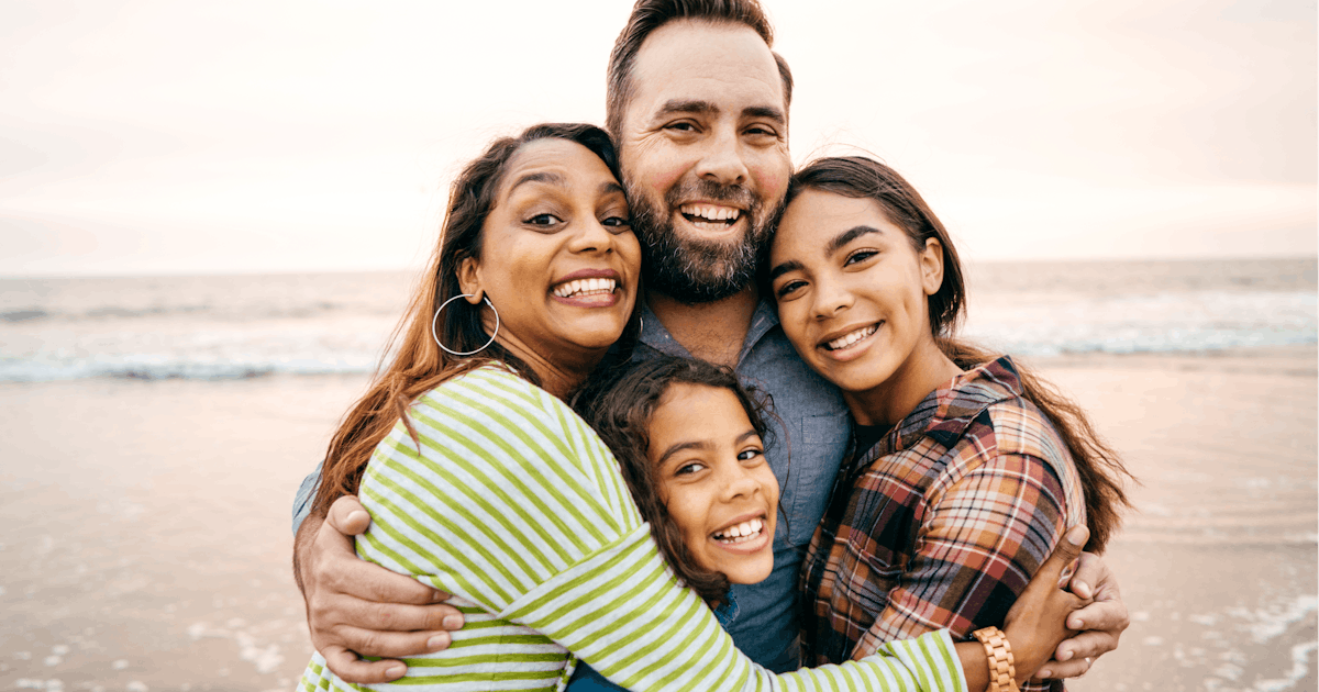 Smiling parents with two children