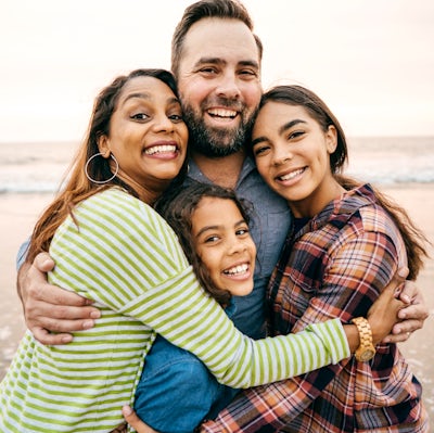 Smiling parents with two children