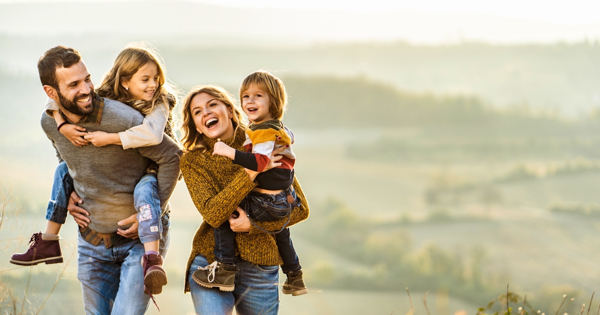 Young happy family enjoying a hike outside
