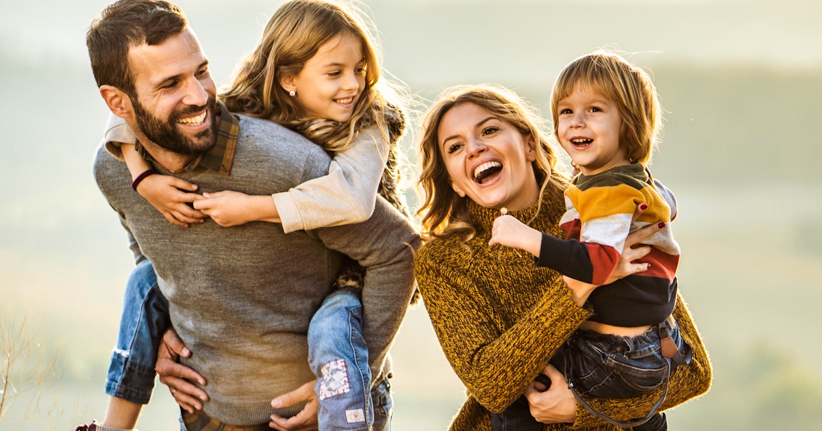 Young happy family enjoying a hike outside