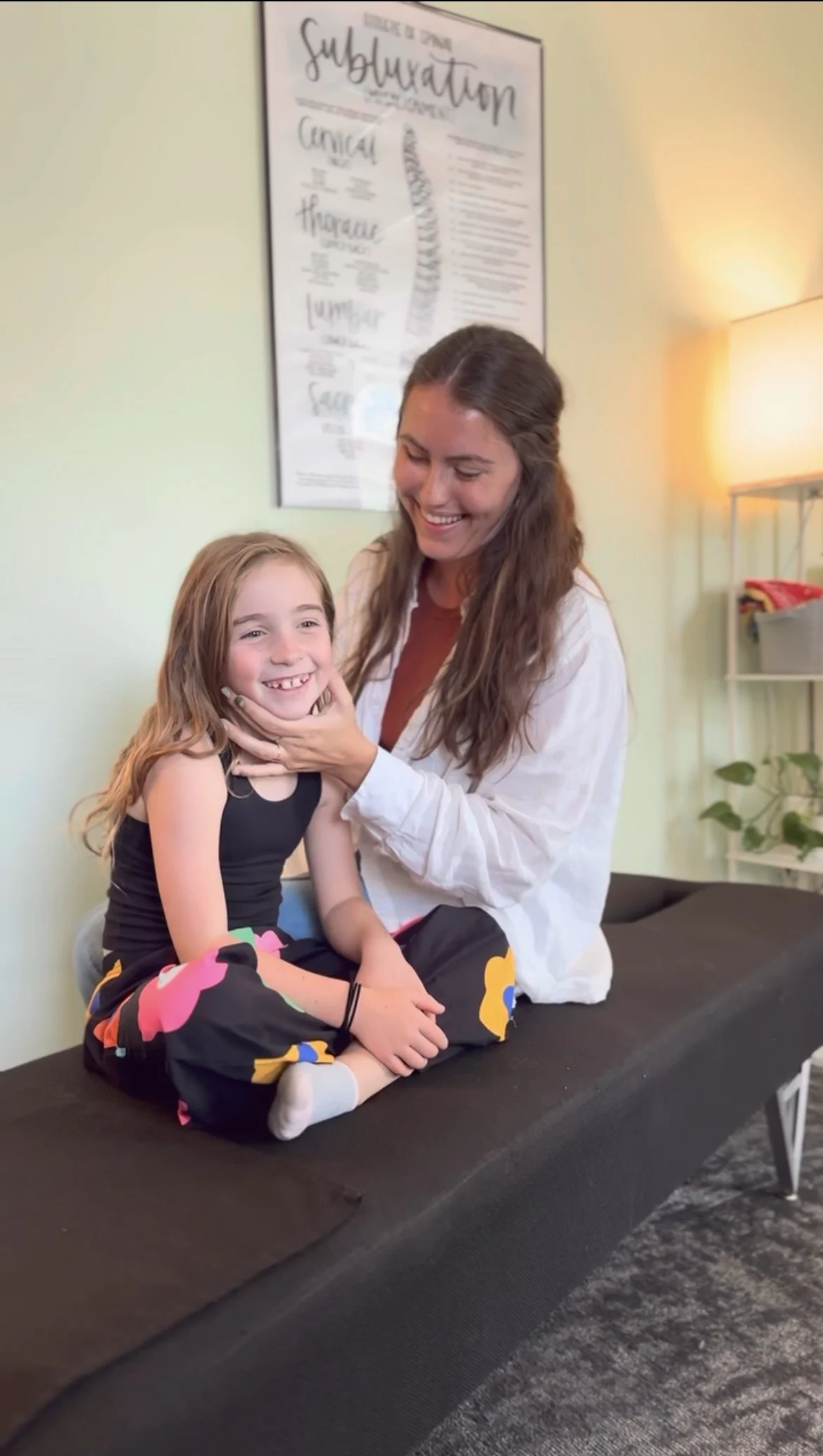 Dr. Simon performing Craniosacral Fascial Therapy on a small child.