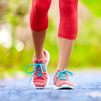 up close female legs jogging running walking outside nature