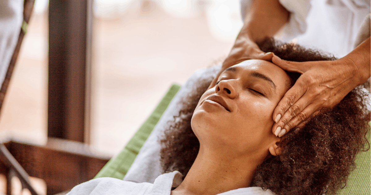 Woman relaxing during head massage