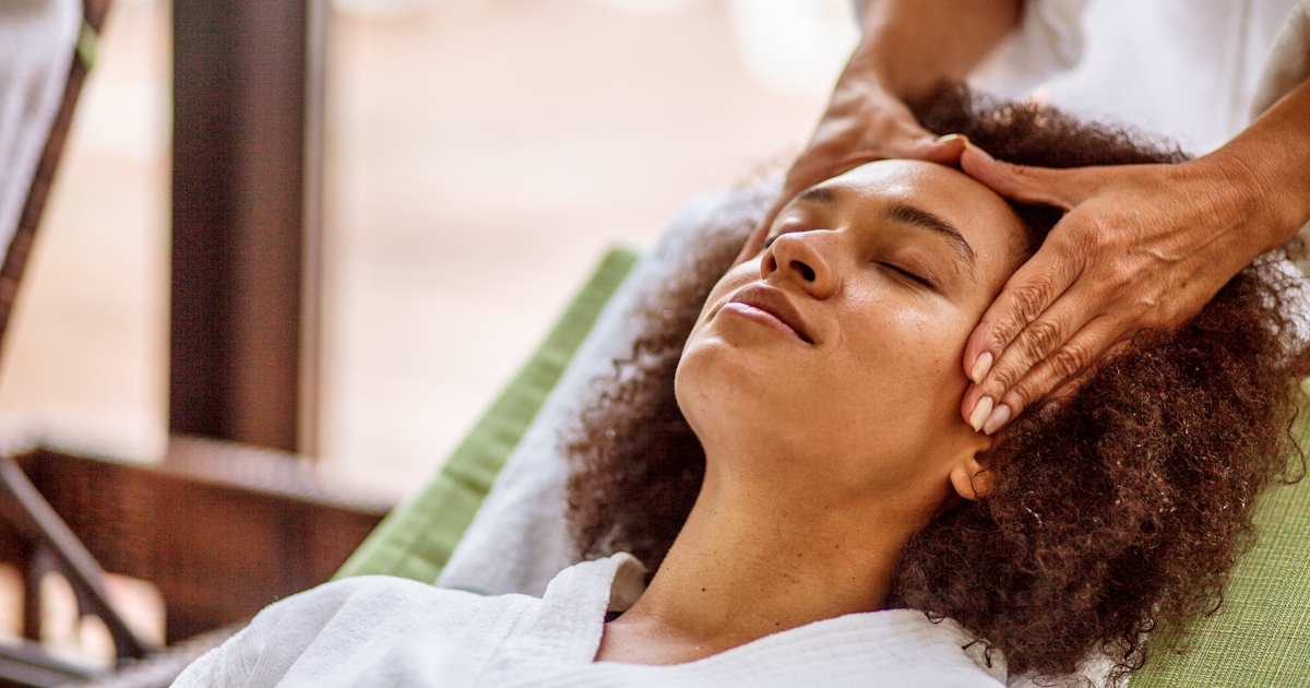 Woman relaxing during head massage