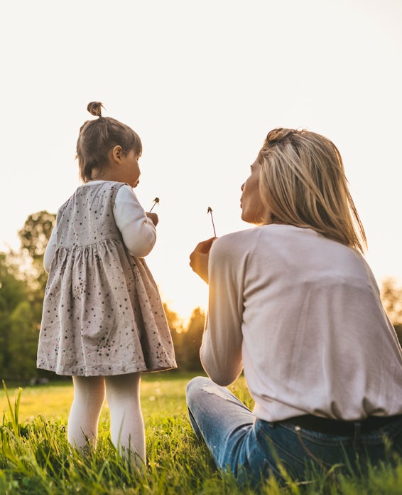 happy mother and child outside family wellness