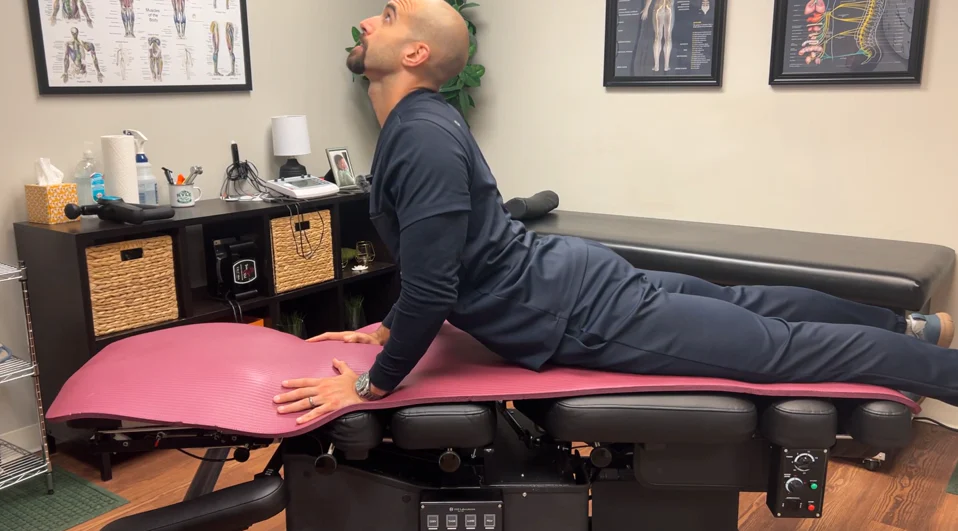 dr. dunning performing the advanced position of the cobra pose stretch