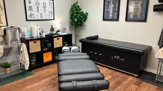 in office photo in a chiropractic clinic of two tables, for a blog post about New Year health goals