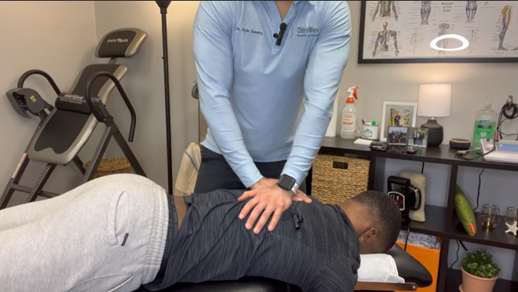 Dr. Kyle Dunning performing chiropractic care on a patient