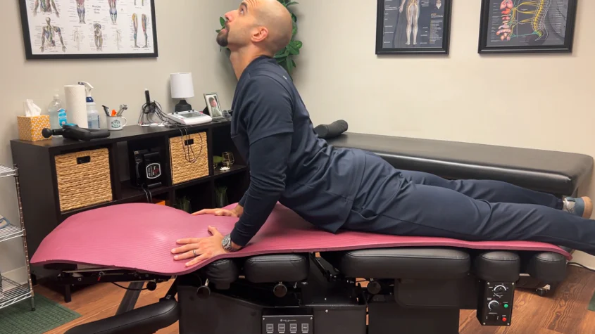 dr. dunning performing an advanced cobra stretch