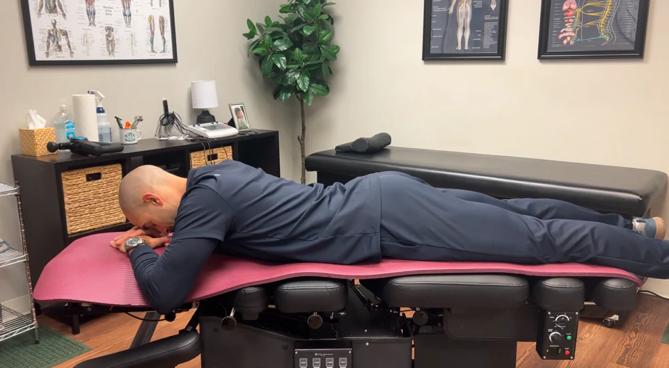 dr. dunning performing the beginners initial position of the cobra pose stretch
