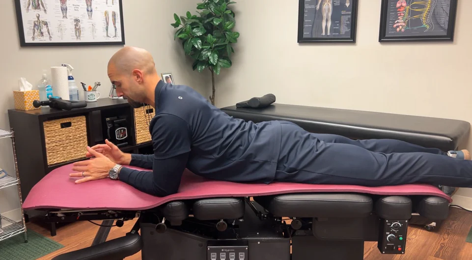 dr. dunning performing the intermediate position of the cobra pose stretch