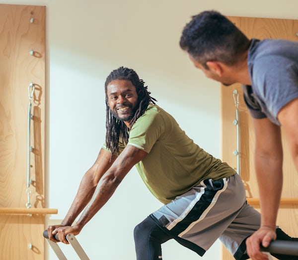 Sportsmen Having Workout at Pilates Studio