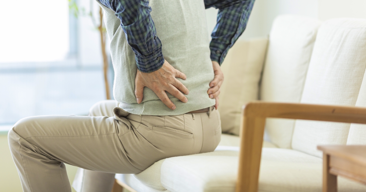 Senior man hurting his back