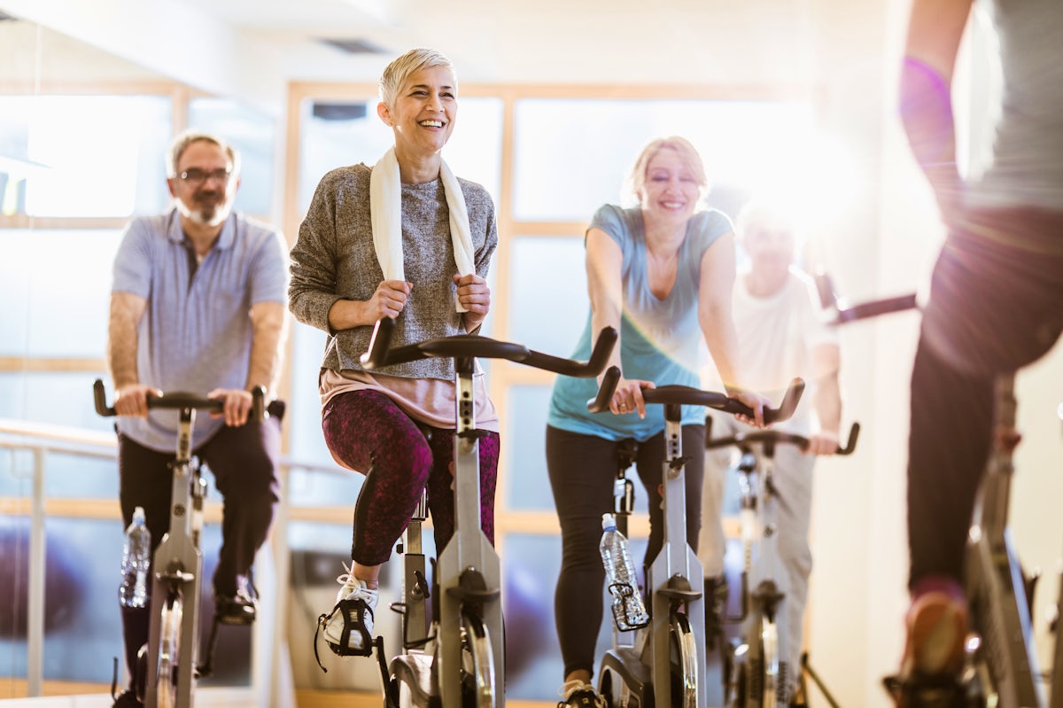 Group of active seniors having exercise class with