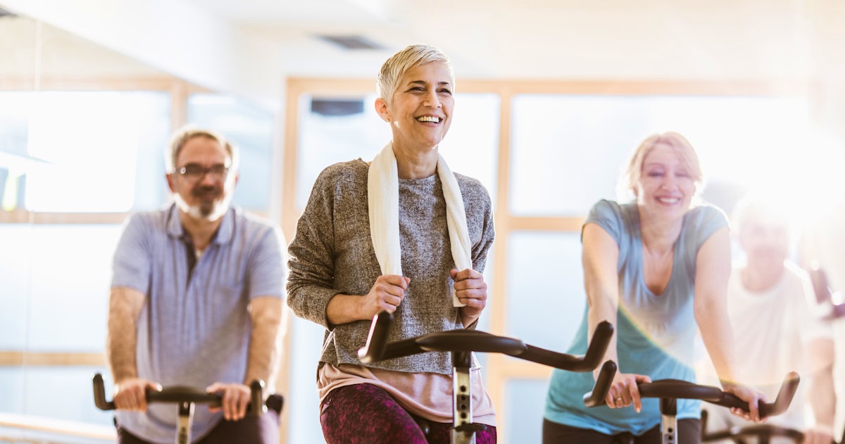 Group of active seniors having exercise class with