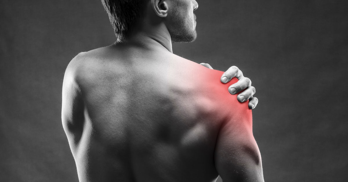 Pain in the shoulder on gray background