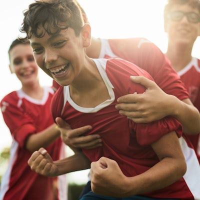 A soccer player celebrates a goal.