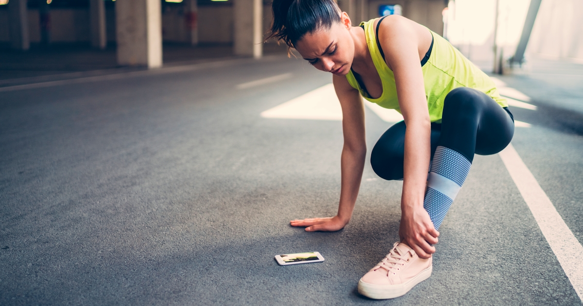 Sportswoman with injured ankle