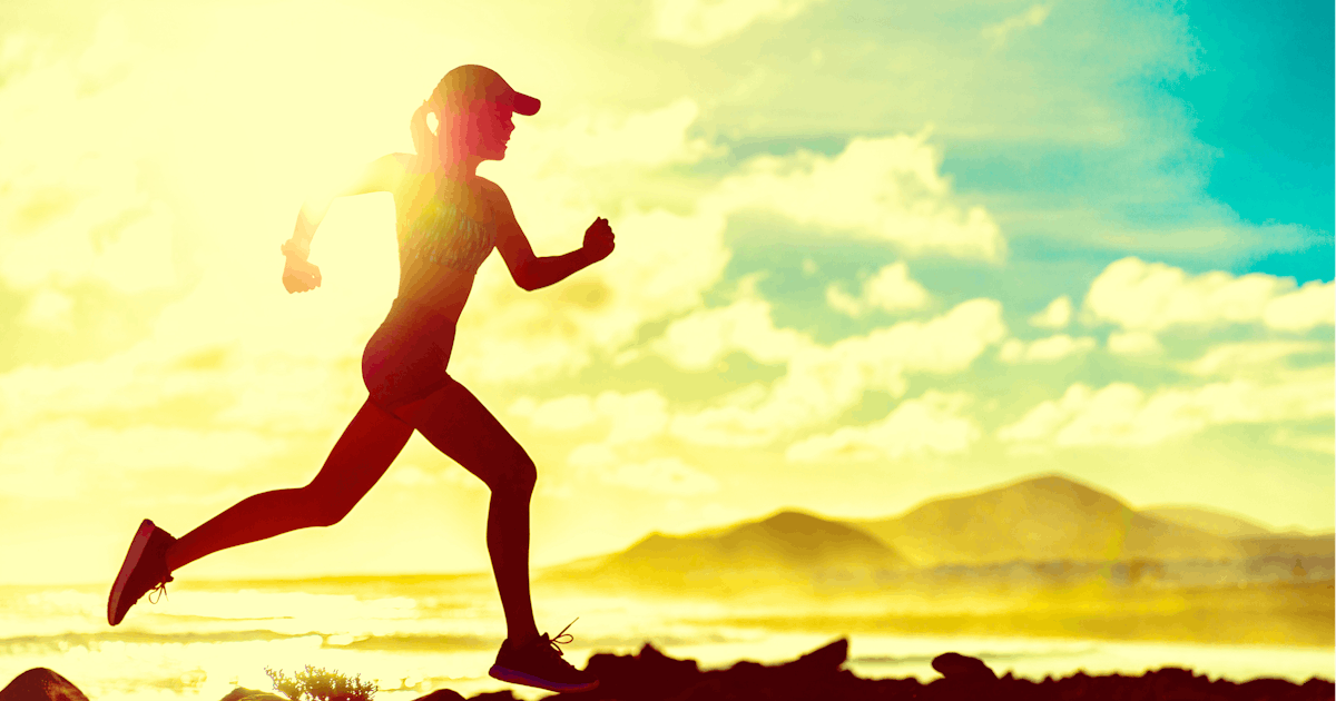 silhouette of female running outside sunset beautiful serene clouds