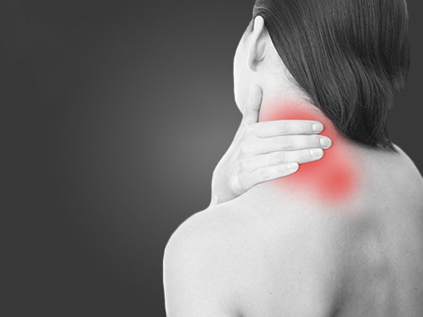 woman experiencing neck and shoulder pain a common symptom in fibromyalgia and chronic pain conditions