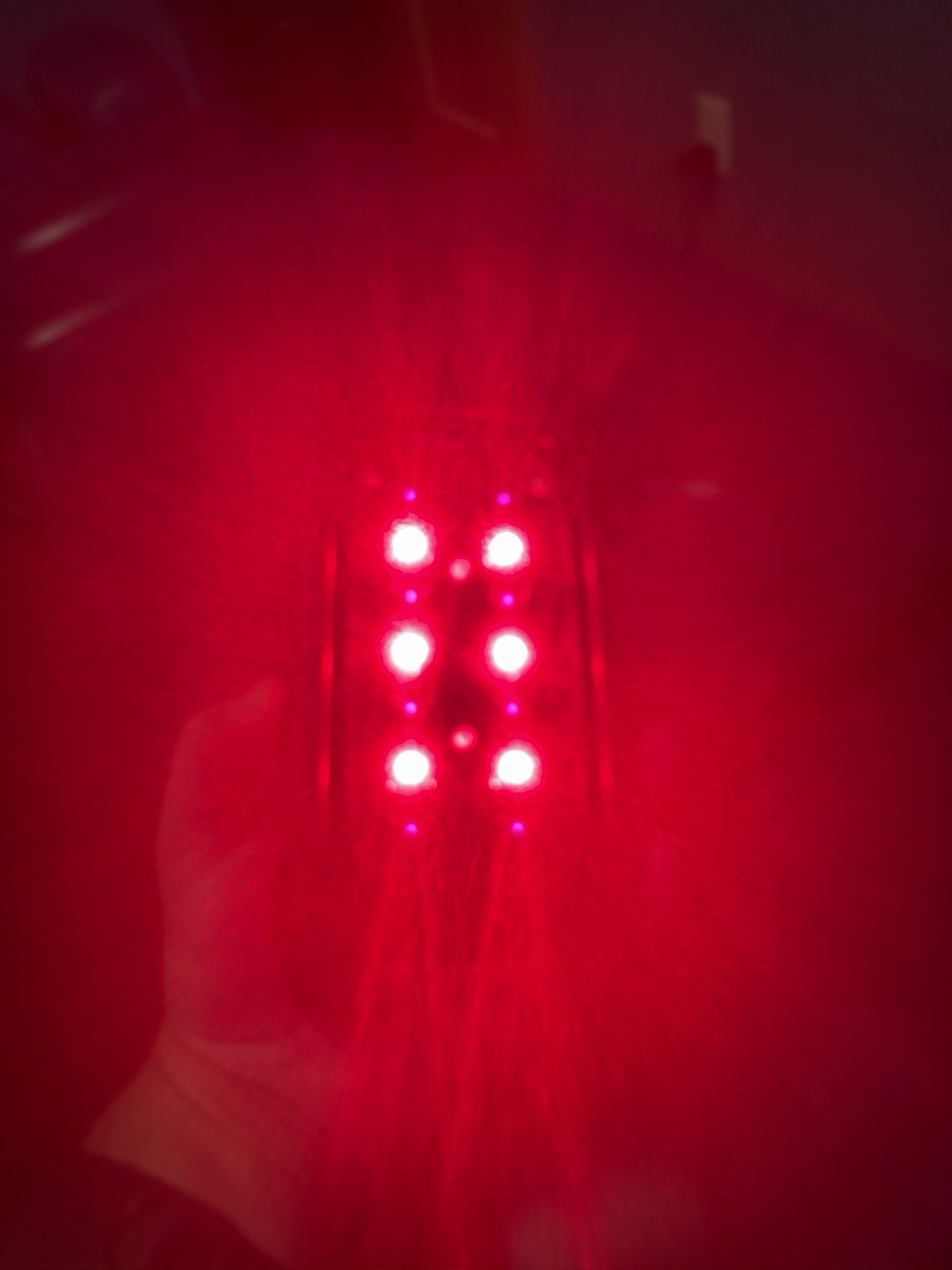 Red light from a photobiomodulation treatment device at Boundless
