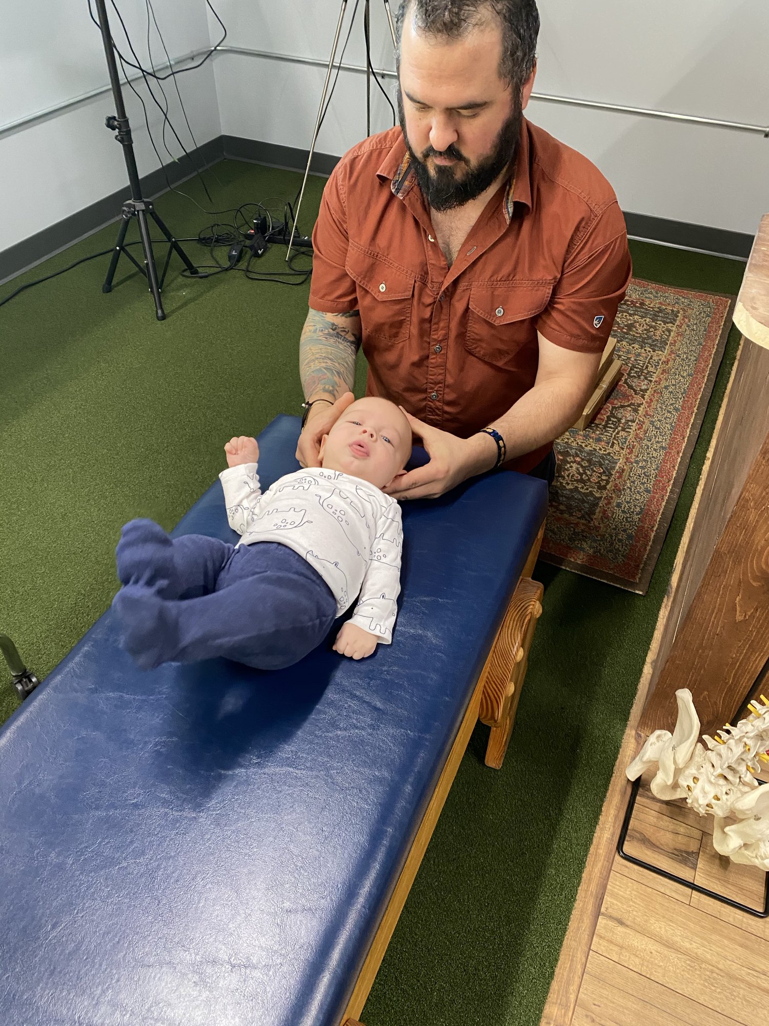 Child receiving chiropractic care on a treatment table at Boundless